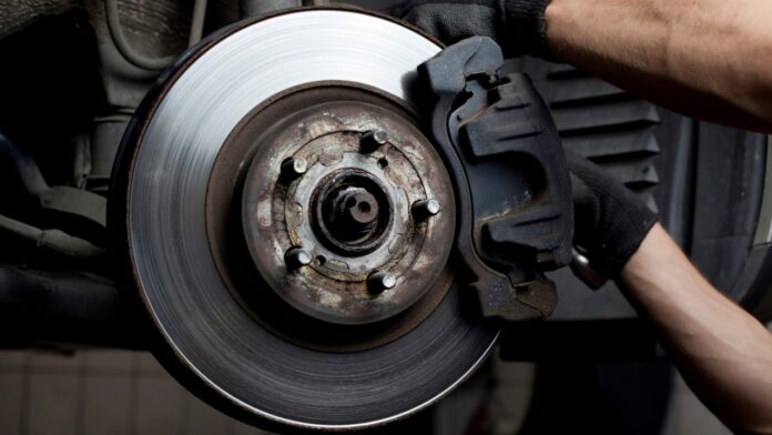 Car mechanic repair brake pads